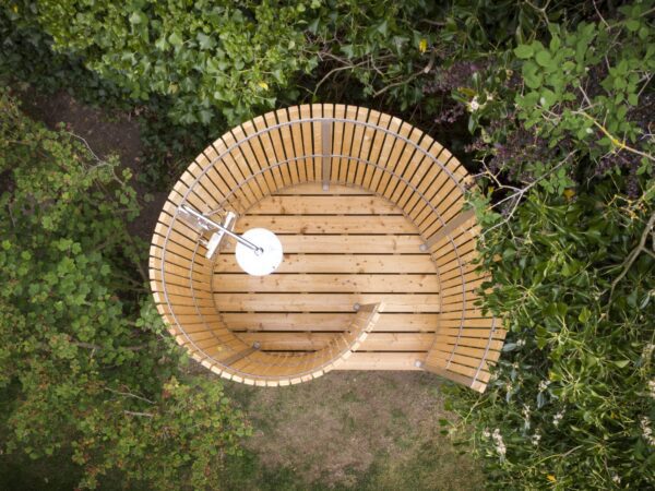 Nordic Seashell outdoor shower - drone photo taken from summer house on the South Sea Islands