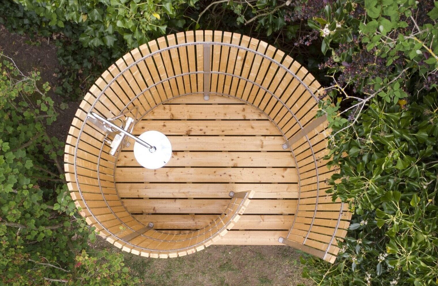 Nordic Seashell outdoor shower - drone photo taken from summer house on the South Sea Islands